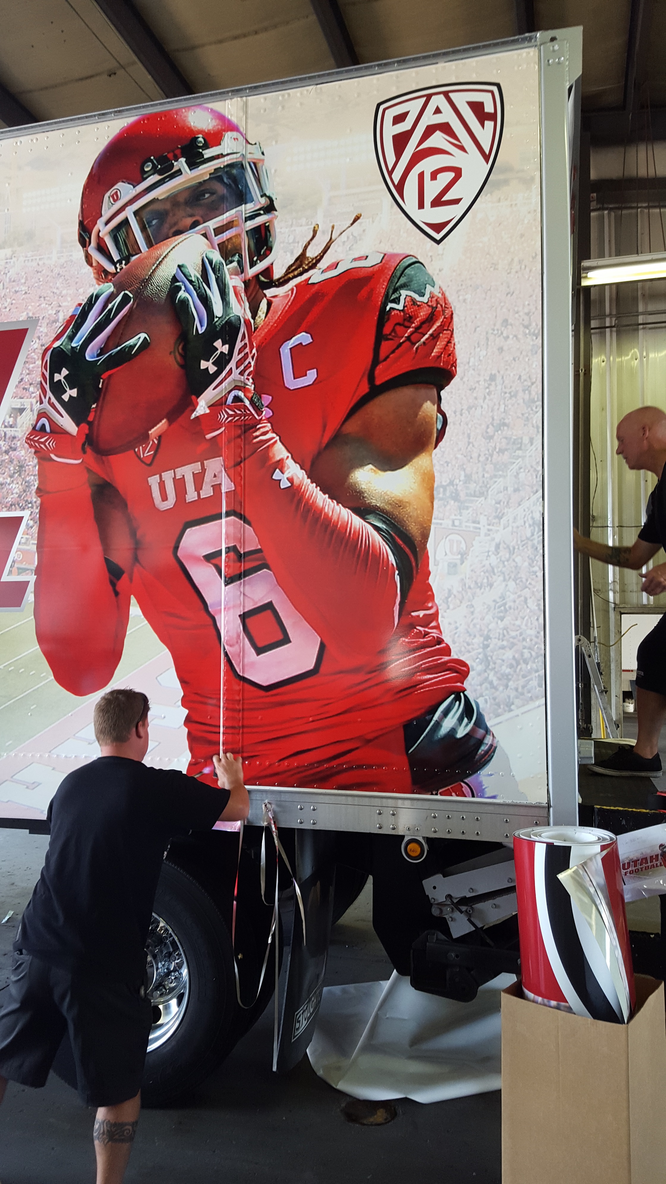 Vehicle Wrap that shows a University of Utah Football Player 